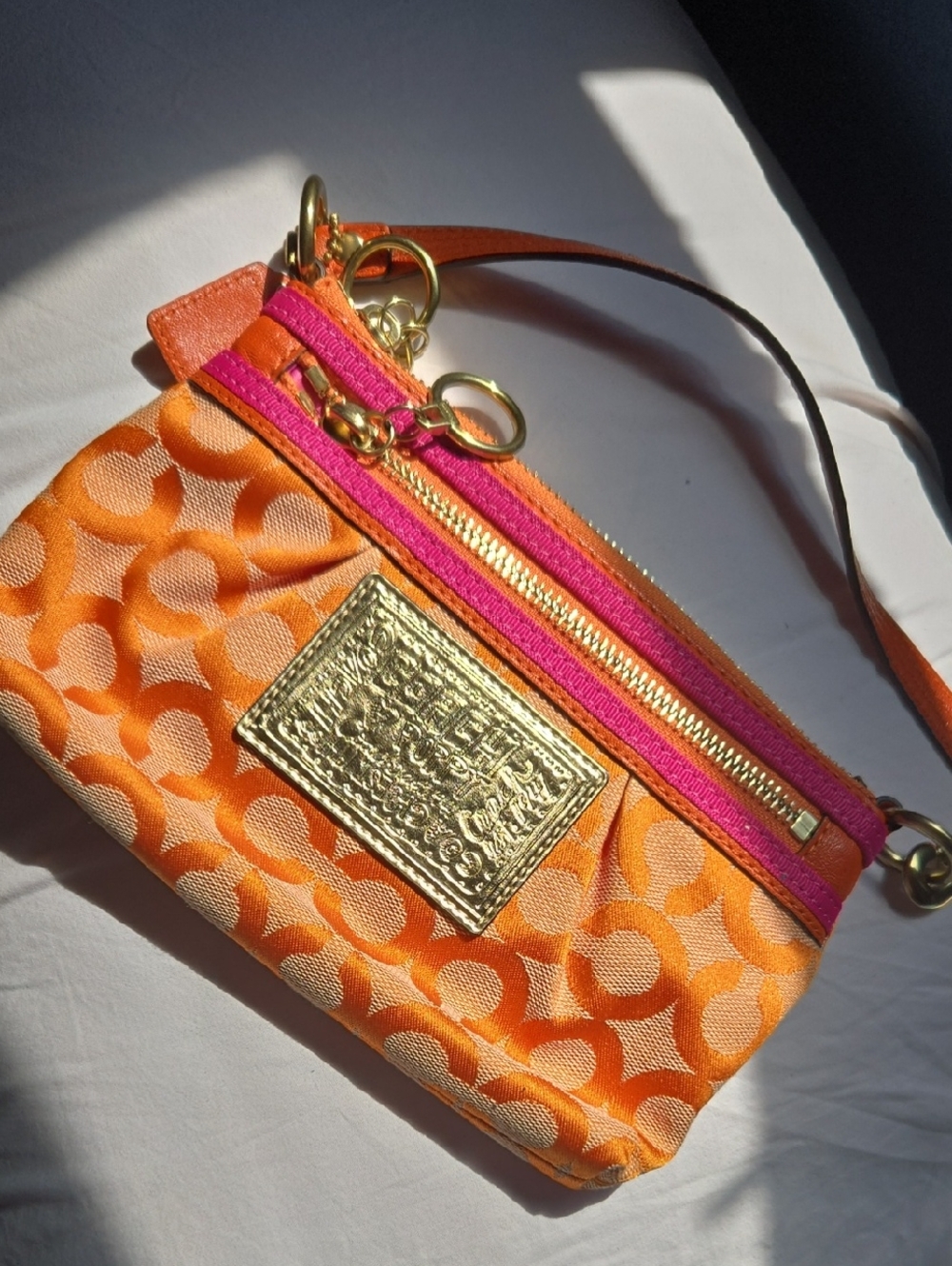 Coach Orange and Pink Poppy Signature Wristlet with Gold Plaque